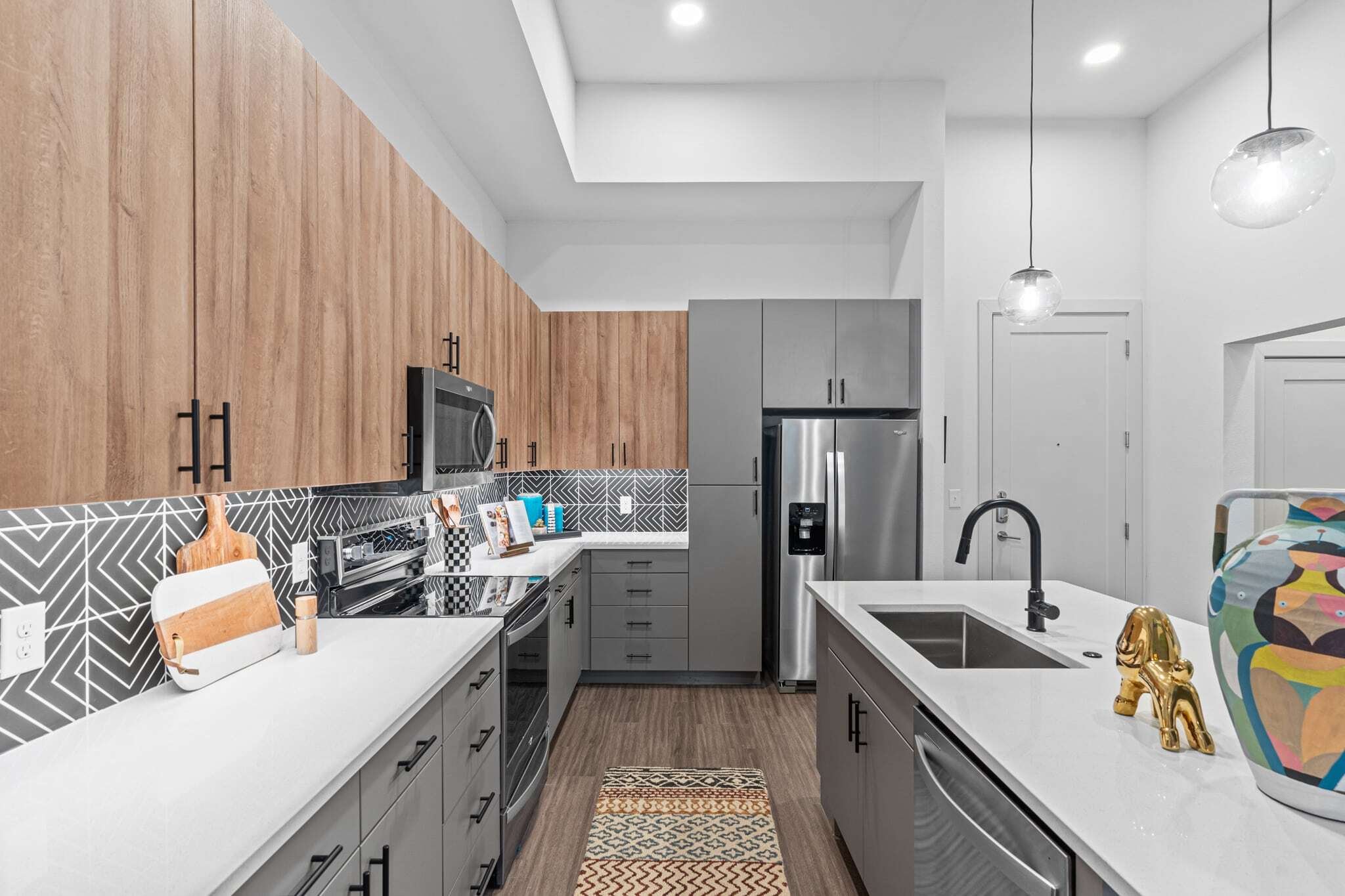 Bishop Momo South Austin Apartments Modern Kitchen with Hardwood Floors